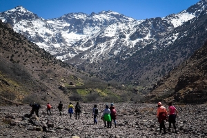 People walking in valley of Atlas mountains